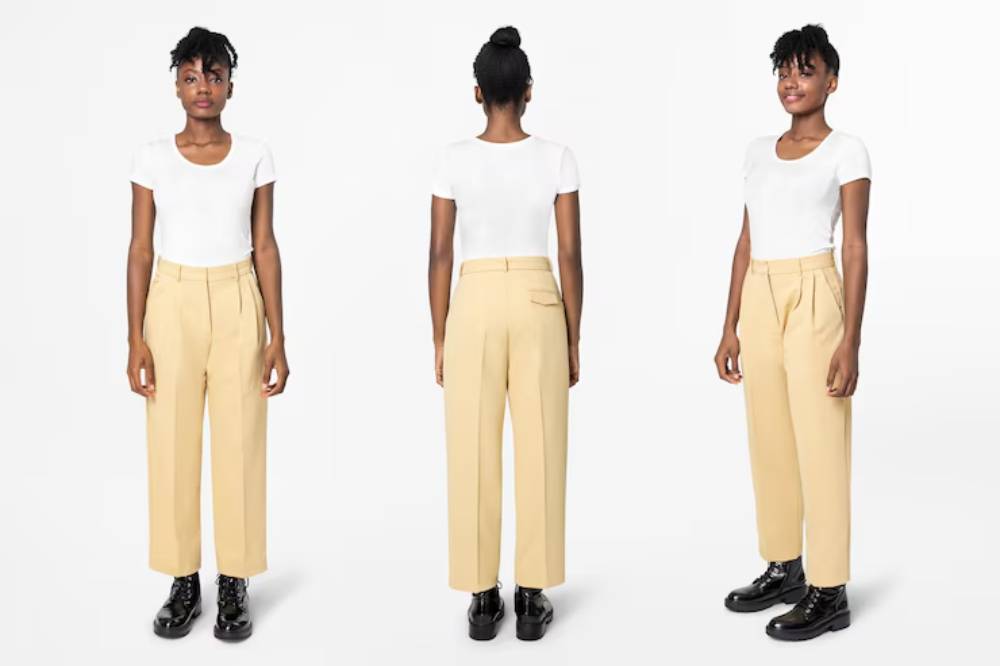 A person stands wearing a plain white t-shirt and high-waisted beige trousers, paired with black shoes, shown from multiple angles.
